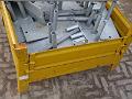 Yellow bin of metal parts-1